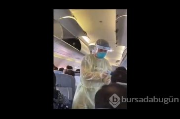 Çin'deki uçakta yolculara virüs taraması yapıldı