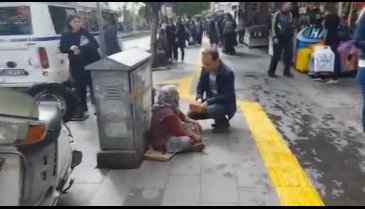 Alkol alıp dilenen yaşlı kadın hakaretler yağdırdı