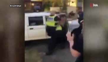 Polis yerdeki zanlıyı tekmeledi