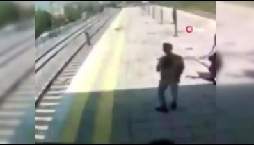 İntihara kalkışan kadını trenin önüne atlayıp kurtardı