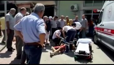Bursa'da vatandaş şemsiye açarak yaralıyı güneşten korudu