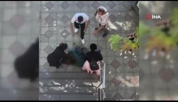 Kocasıyla ilişkisi olduğunu iddia ettiği kadına cadde ortasında saldırdı
