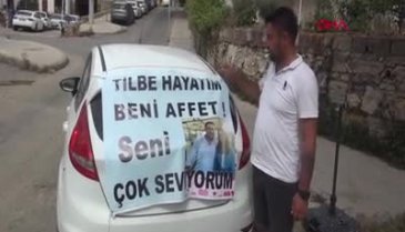 Muğla'da eşinden özür dilemek için arabaya pankart astı