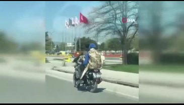 Bursa'da 2 kişi kangal cinsi köpeği aralarına alıp motosikletle trafikte görüntülendi