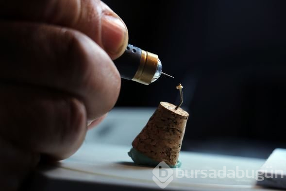 İncir çekirdeğine İhlas suresini yazdı
