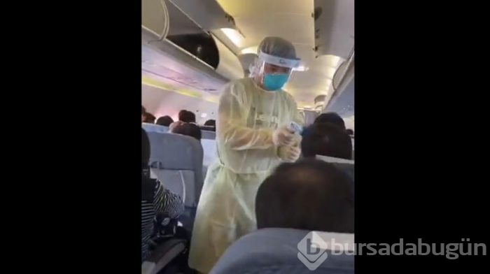 Çin'deki uçakta yolculara virüs taraması yapıldı