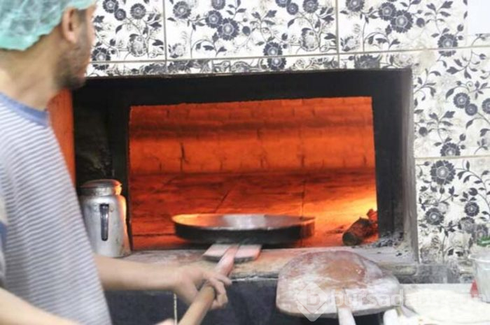 Virüse karşı madeni paraları fırında ısıtıyor