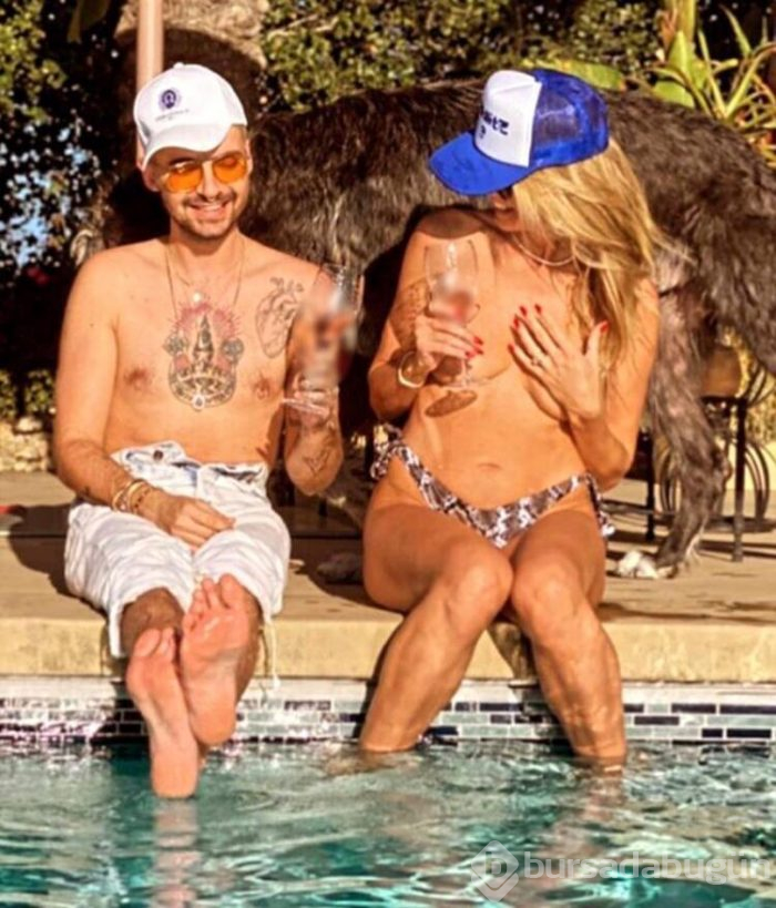 Heidi Klum, havuz başında üstsüz güneşlendi
