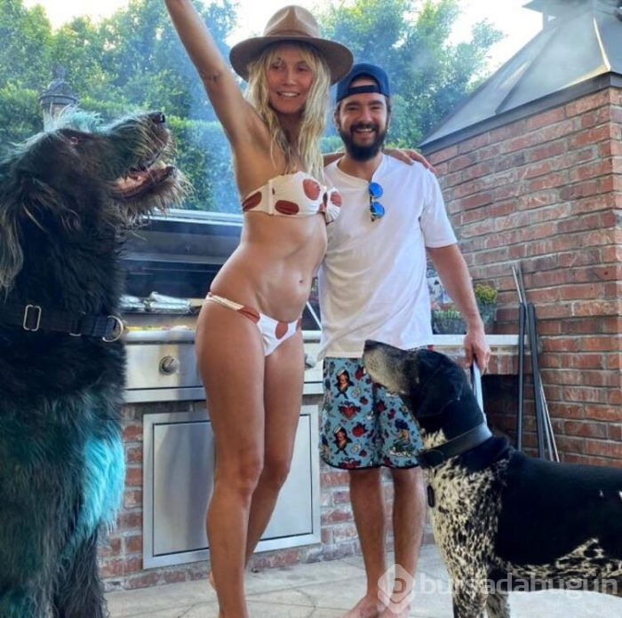 Heidi Klum, havuz başında üstsüz güneşlendi