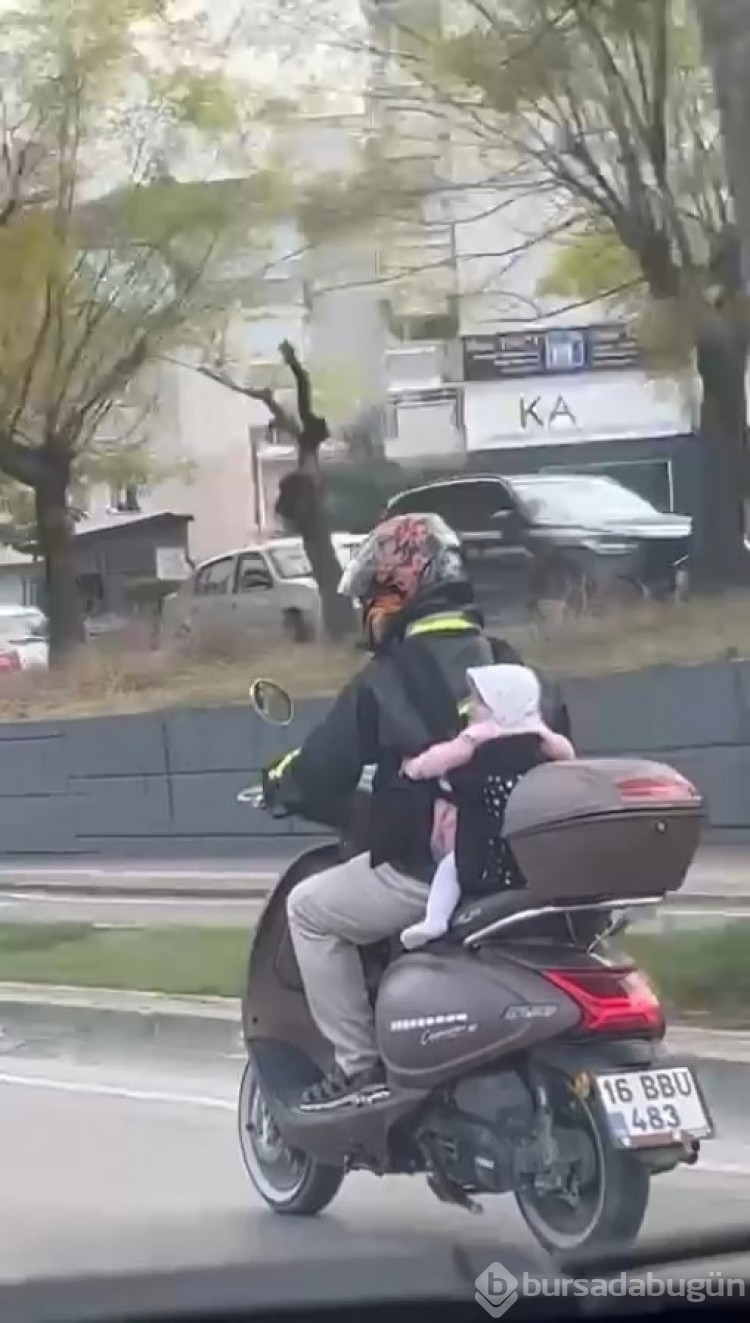 Bursa'da motosiklet sürücüsü baba bebeğini arkasına bağladı