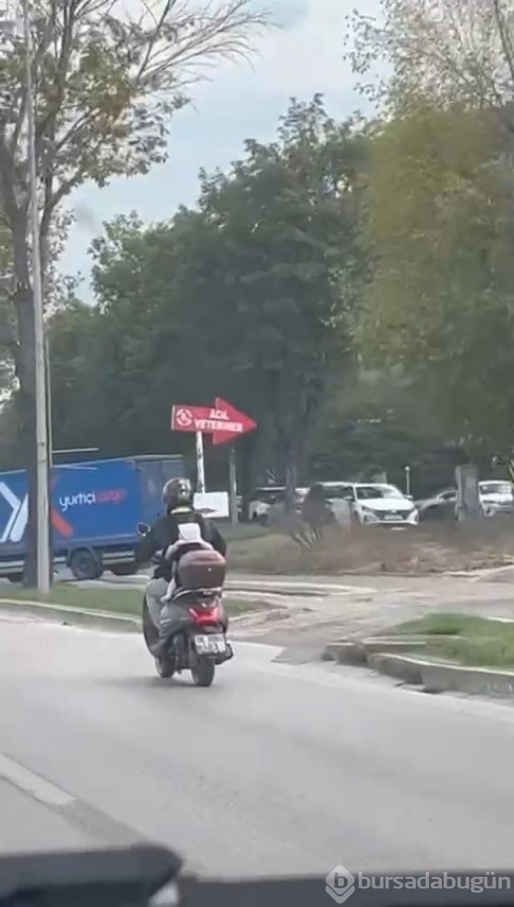 Bursa'da motosiklet sürücüsü baba bebeğini arkasına bağladı