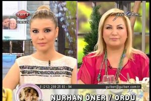G&uuml;lben canlı yayında y&uuml;z&uuml;ne maske s&uuml;rd&uuml;