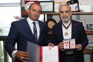 Cumhurbaşkanı Başdanışmanı Top&ccedil;u'ya '&Uuml;st&uuml;n Hizmet Nişanı'
