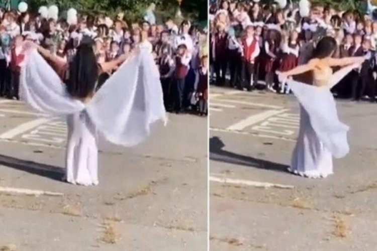 Kadın &ouml;ğretmen okul a&ccedil;ılışında dans&ouml;z kıyafetiyle g&ouml;bek attı
