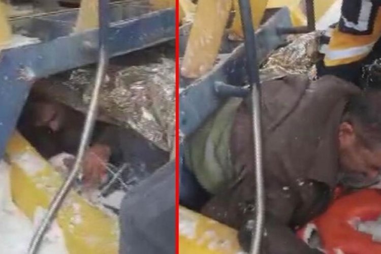 Devrilen iş makinesinin altında kaldı