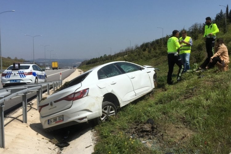 Bursa'da takla atan otomobilden yara almadan kurtuldu