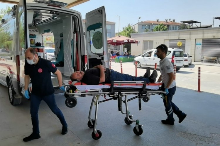 Bursa'da iş&ccedil;i, makineye sıkıştı