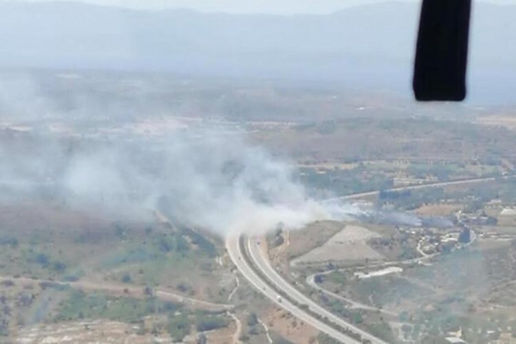 İzmir'de makilik alanda &ccedil;ıkan yangına m&uuml;dahale başladı