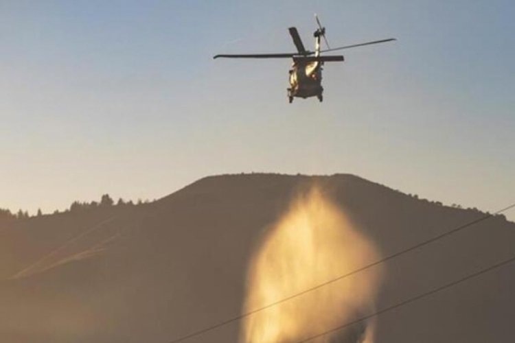 G&uuml;rcistan'da helikopter dağlık alana d&uuml;şt&uuml;: 8 kişi hayatını kaybetti