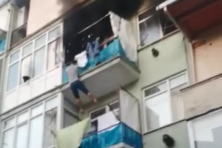Yanan evin balkonundan bir alt kattaki&nbsp;balkona&nbsp;atladı