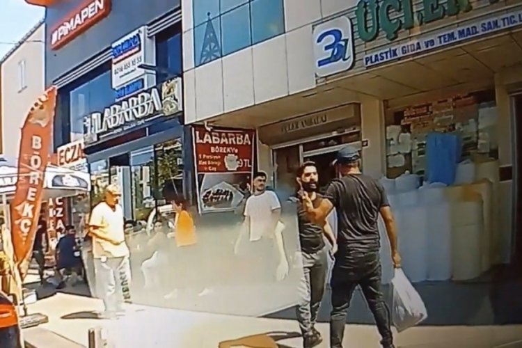 Tartıştığı eşini sokak ortasında darp etti