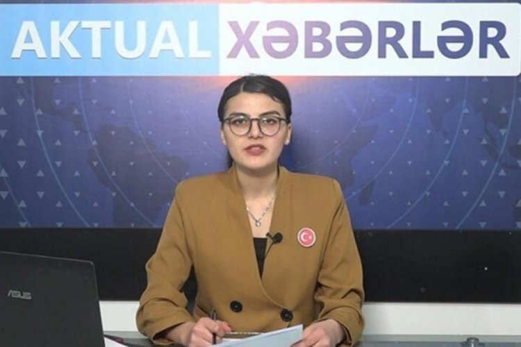 G&uuml;rcistan'da spiker yayına T&uuml;rk bayrağı rozetiyle &ccedil;ıktı