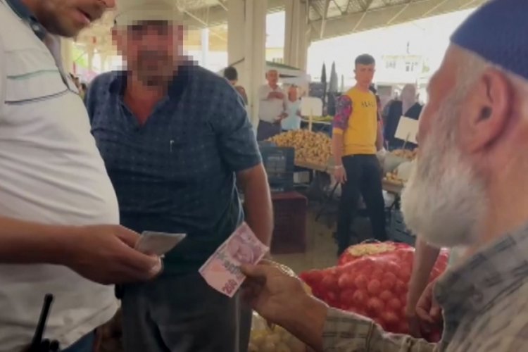 Sahte 10 bin TL ile alışveriş i&ccedil;in &ccedil;ıktığı pazarda esnafa yakalandı
