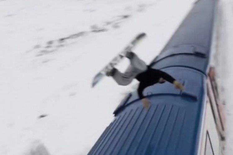 Snowboardla Doğu Ekspresi'nin &uuml;zerinden atladı