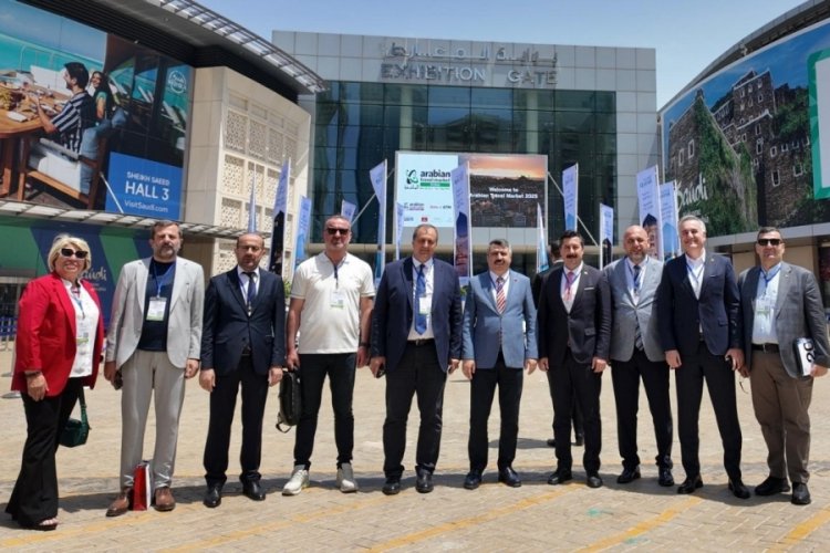 Ercan Özel, Yenişehir'i dünyaya tanıtıyor