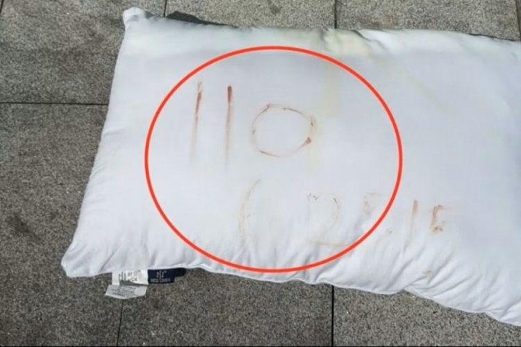 Üzerine kanla '110 625' yazdığı yastık sayesinde kurtarıldı