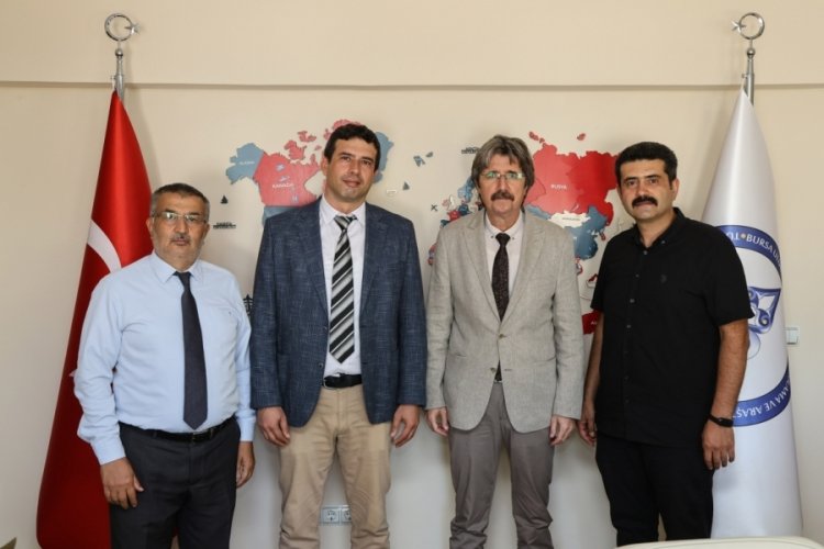 TÜDAM'da bayrak değişimi
