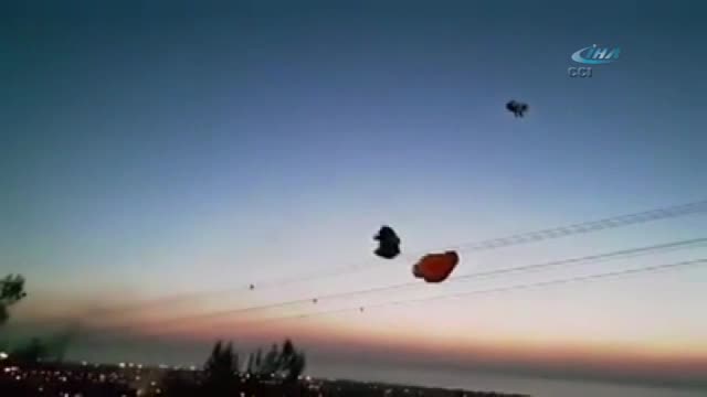 Paraşütçü helikopterin rüzgarıyla yere çakıldı