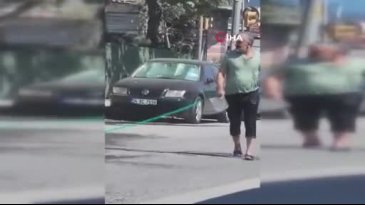 Sıcaktan bunaldı: Hortumla hem kendini hem de aracını yıkadı