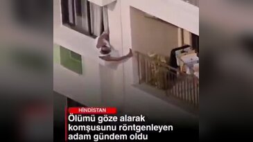 Sapkınlıkta son nokta! Metrelerce yükseklikte pencereden sarkarak komşusunu gözetledi