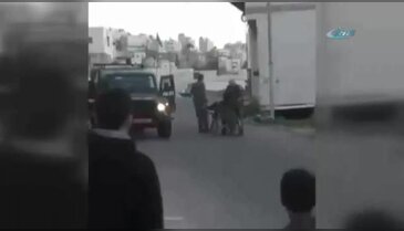 İsrail askeri tekerlekli sandalyedeki Filistinliyi yere attı