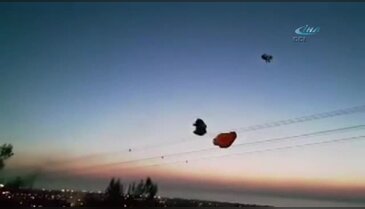 Paraşütçü helikopterin rüzgarıyla yere çakıldı