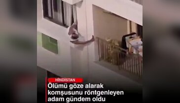 Sapkınlıkta son nokta! Metrelerce yükseklikte pencereden sarkarak komşusunu gözetledi